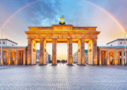 Berlin Brandenburger gate with rainbow.